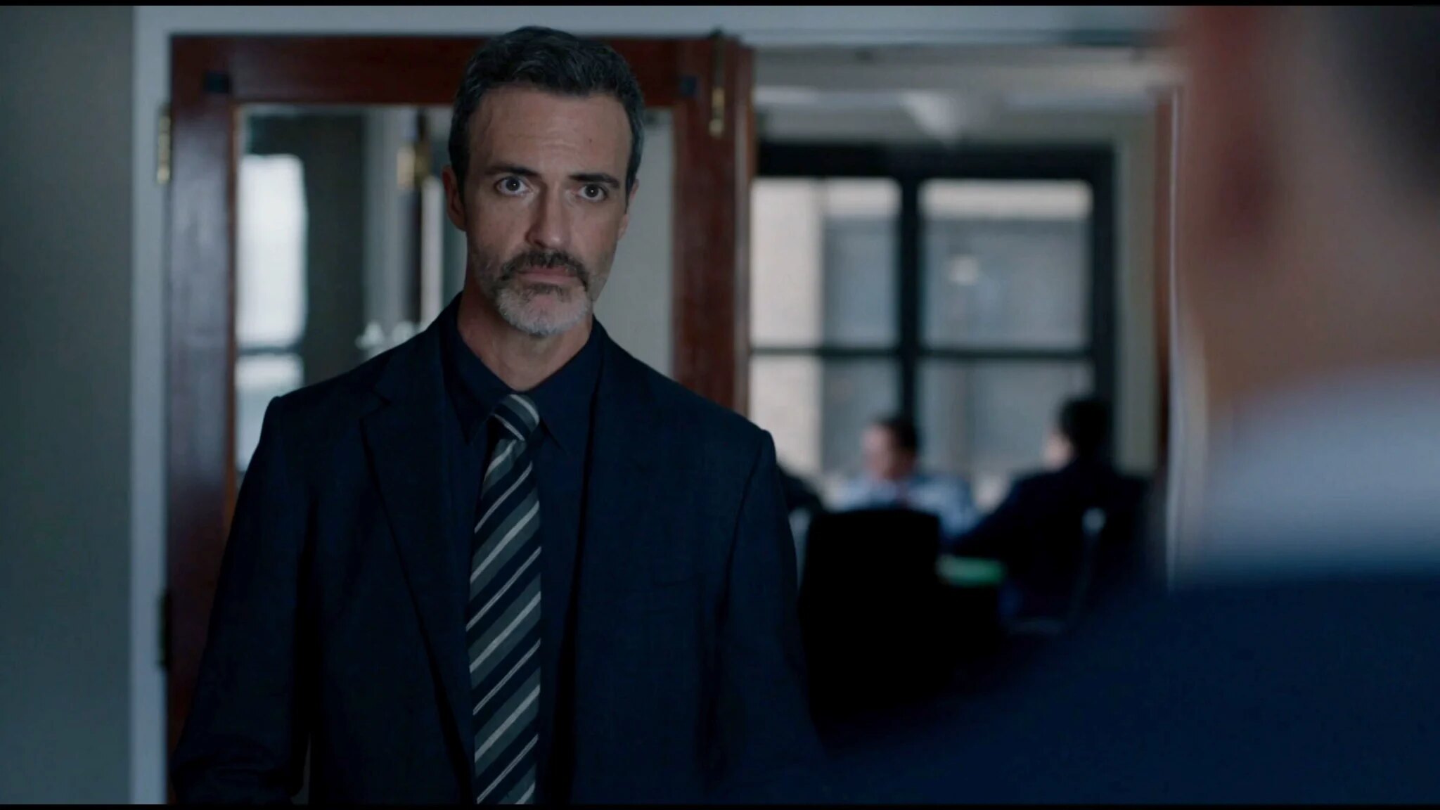 Detective Vincent Riley in Brian White's office