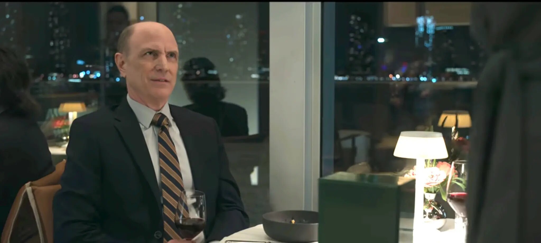 Drew Moore as Byron Gedney at dinner
