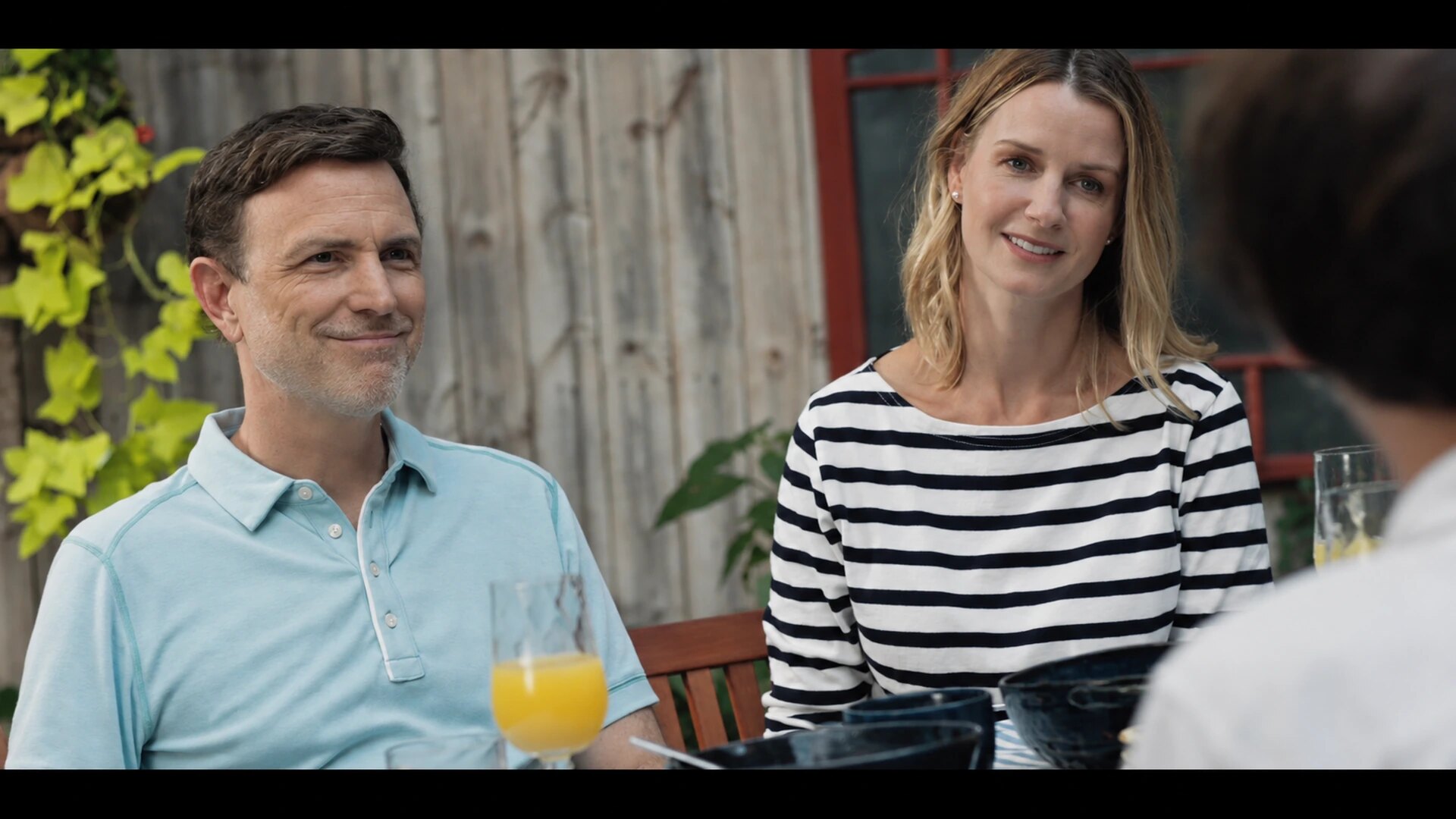 Drew Moore and Shannan Wilson seated together as Mark and Nancy
